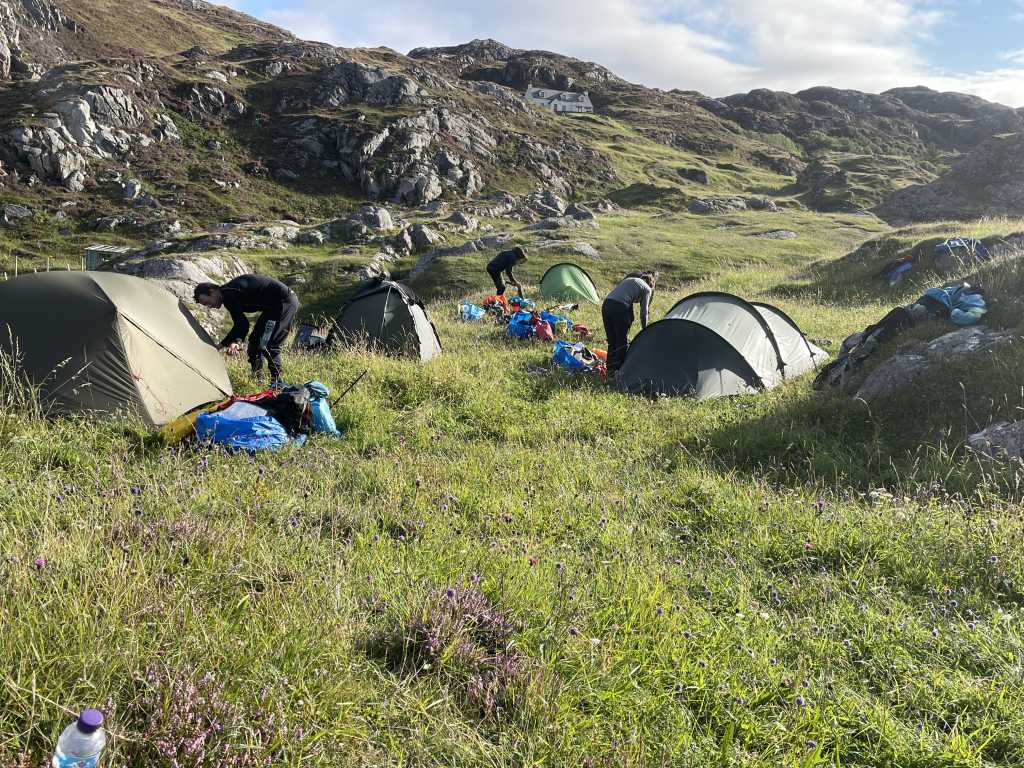 Packing up camp above Achmelvich in the morning sun