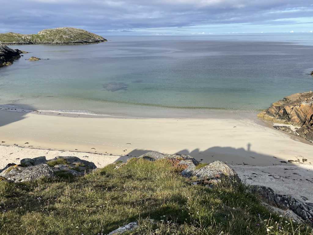 White sand and clear water at Achmelvich Bay seen from the camp above